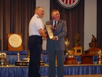 Maj Art Rozier receiving the LeMay Award from Mr. Bill Blankenship