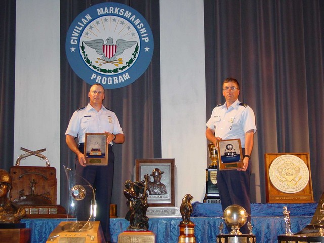 Majs Rozier and McCormick with Generals LeMay and Spaatz Trophies and Plaques, respectively