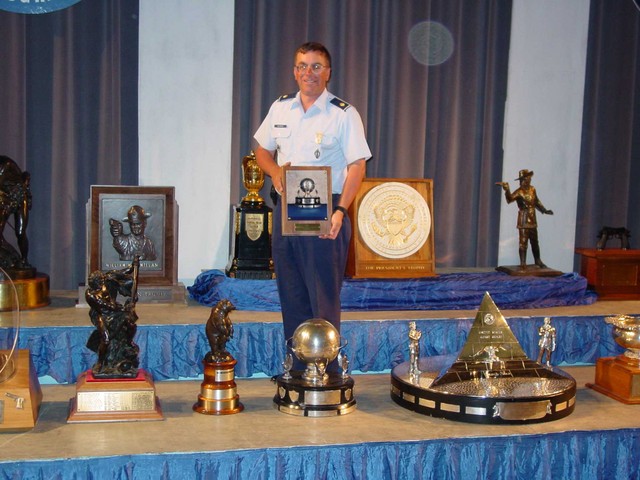 Maj McCormick with General Spaatz Trophy and Plaque