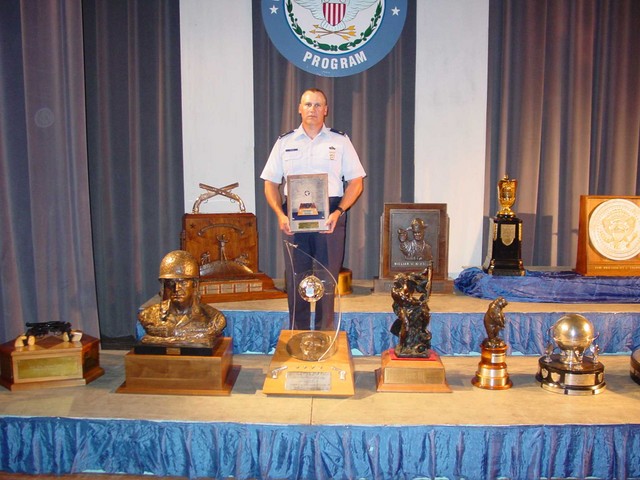 Maj Rozier with General LeMay Trophy and Plaque