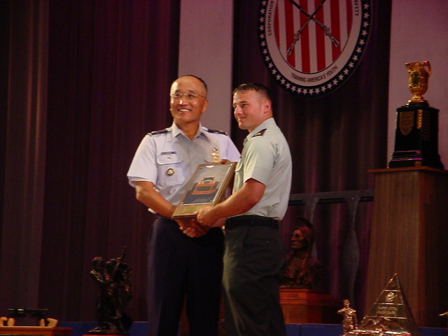 Col Chang presenting the US Army Forces Command Trophy to SGT Robert Park, II, USA