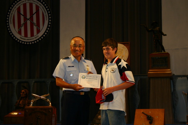 Rafe Corley of TSRA Jrs receiving a Certificate of Achievement for his Third Place finish in the Junior President's Pistol Match (.22). See Team News for more information.