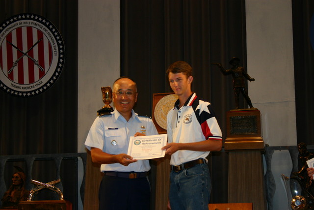 John Seward of TSRA Jrs receiving a Certificate of Achievement for his Second Place finish in the Junior President's Pistol Match (.22). See Team News for more information.