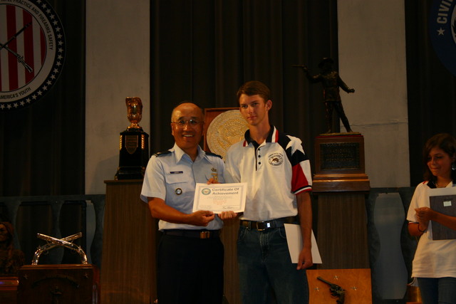 John Seward of TSRA Jrs receiving a Certificate of Achievement for his Second Place finish in the Junior Individual Pistol Match (.22). See Team News for more information.