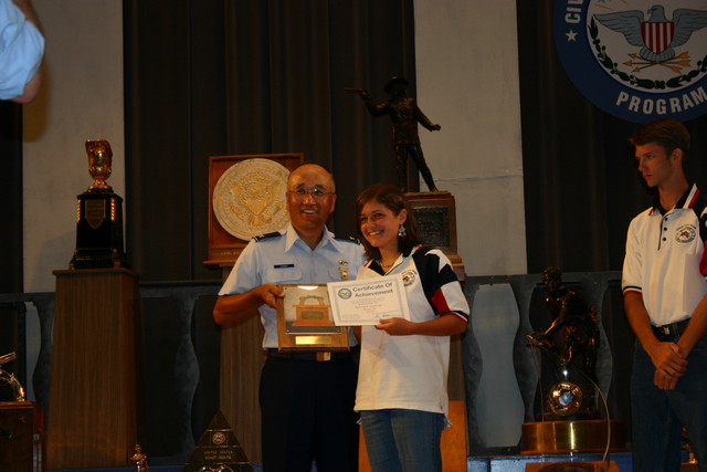 Col Chang presenting the Junior Pistol Trophy Plaque to Rebekah Jennings of TSRA Jrs. See Team News for more information.