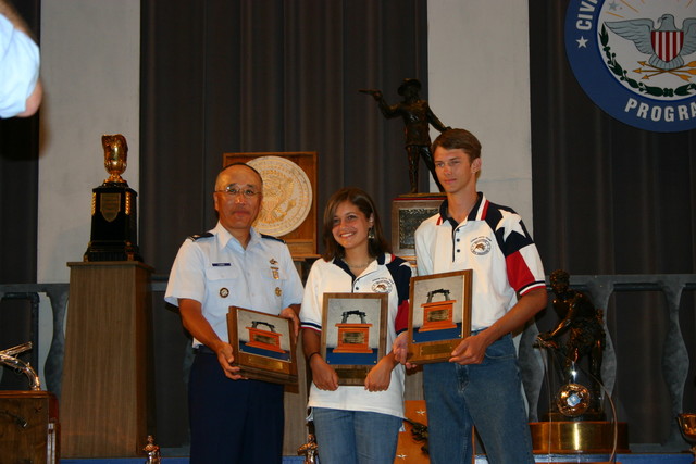 Col Chang presenting the Junior Pistol Team Trophy Plaques to the TSRA Jr Gold Team (Rebekah Jennings & John Seward). See Team News for more information.
