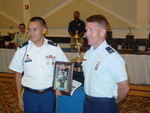 SPC Lawrence Cleveland receiving his Exellence-In-Competition Award from Col Mark Teskey