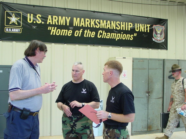 Coach Hall speaking with LtCol Rozier and Col(s) Teskey
