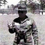 Maj Bassham, Army Rifle Team OIC, eating carrots