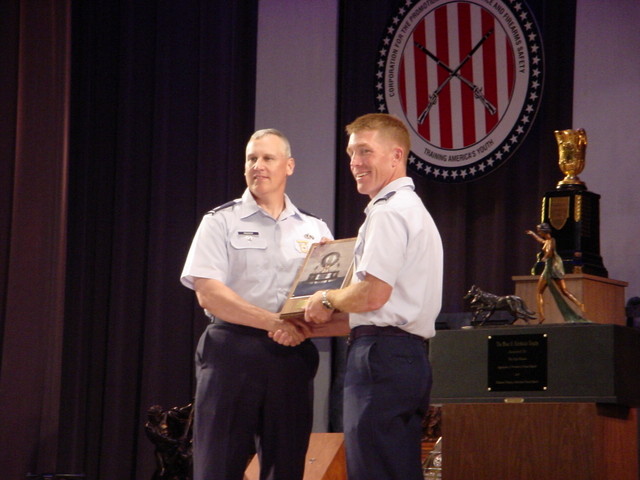 Col Rozier accepting the General Spaatz Award from Col(s) Teskey