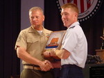 GySgt Zins accepting the Military Police Corps Award from Col(s) Teskey
