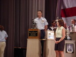TSgt(s) Aguryanov behind the Harold R. Krelstein Trophy
