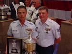 TSgts(s) Aguryanov and Slater with the General Twining Award and Trophy