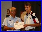 John Seward of TSRA Jrs receiving a Certificate of Achievement for his Second Place finish in the Junior President's Pistol Match (.22)