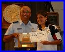 Col Chang presenting the Junior Pistol Trophy Plaque to Rebekah Jennings of TSRA Jrs