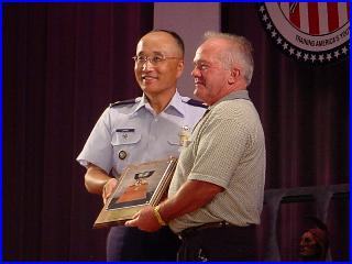 Col Chang presenting the Anheuser-Busch Trophy to Steve Reiter