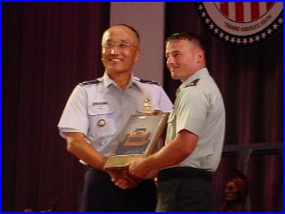 Col Chang presenting the US Army Forces Command Trophy to SGT Robert Park, II