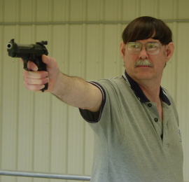 Coach Hall with Beretta 92FS Service Pistol